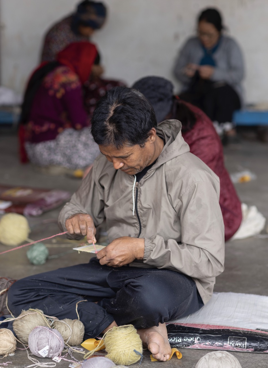 Creative Matter conducts an art workshop with the weavers of Classic Custom Rugs at the rug factory in Kathmandu, Nepal, on March 12, 2025.